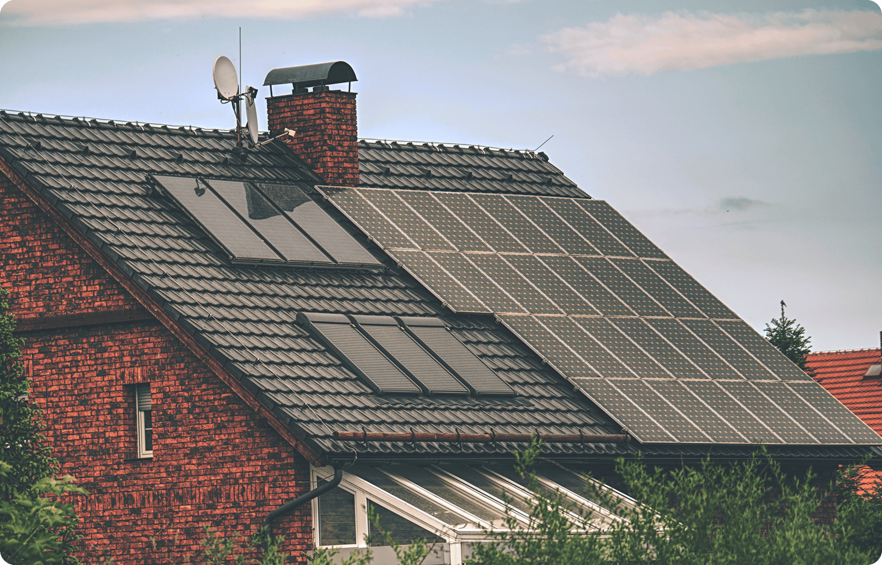 Brick house with solar panels on roof.