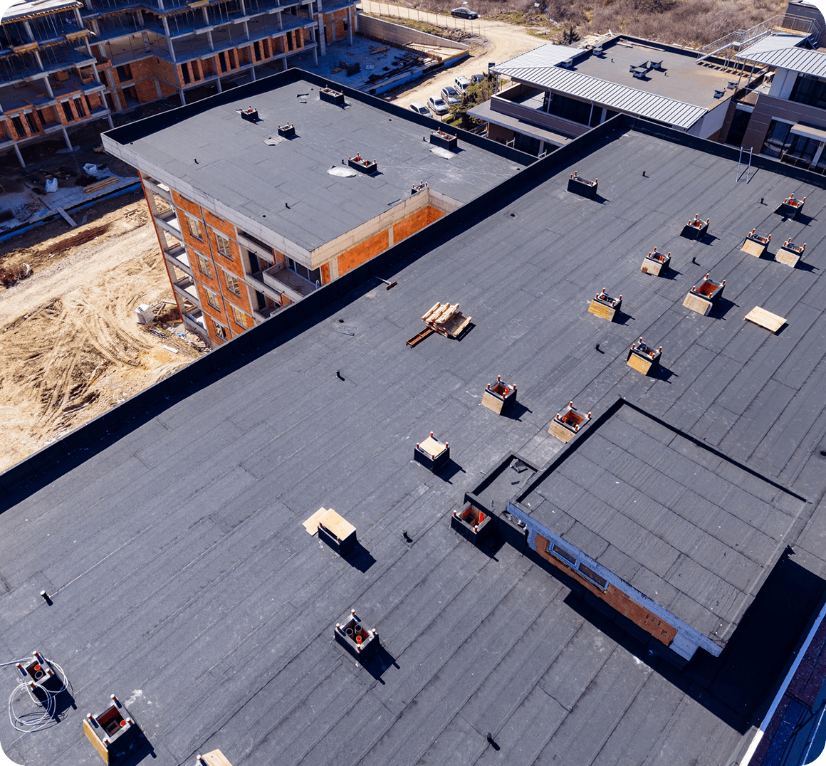 Flat rooftop with multiple ventilation units.